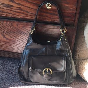 brown leather Coach shoulder bag.